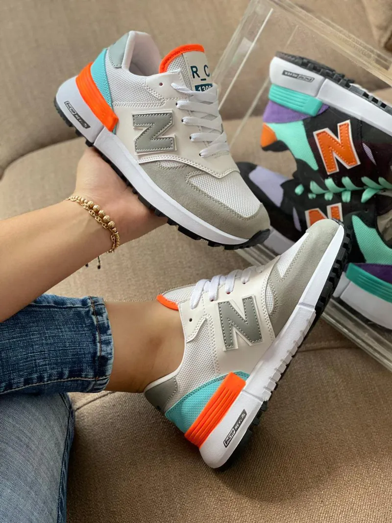 Tenis New Balance Dama Gris Naranja: Estilo y Comodidad en Cada Paso
